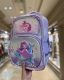 کولهپشتی مدرسهای دخترانه با طرح یونیکورن، پری دریایی و شخصیت کارتونی در رنگهای فانتزی پاستلی