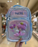 کولهپشتی مدرسهای دخترانه با طرح یونیکورن، پری دریایی و شخصیت کارتونی در رنگهای فانتزی پاستلی