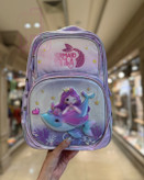 کولهپشتی مدرسهای دخترانه با طرح یونیکورن، پری دریایی و شخصیت کارتونی در رنگهای فانتزی پاستلی